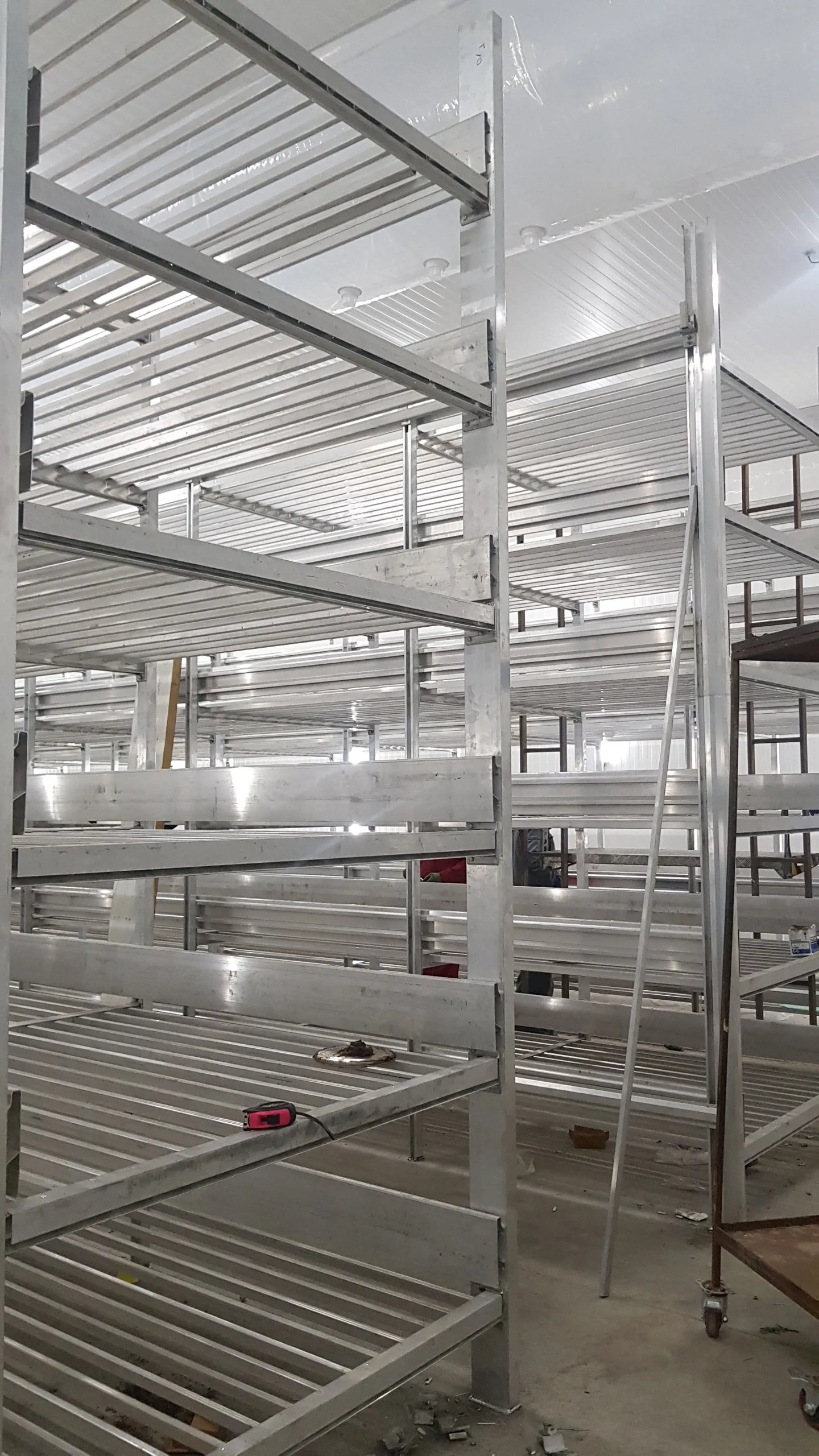 Multi-tier shelving in Sadaf Mushroom — tall view